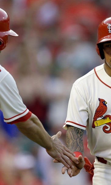Wong helps Masterson win Cards debut with 9-7 victory over Brewers